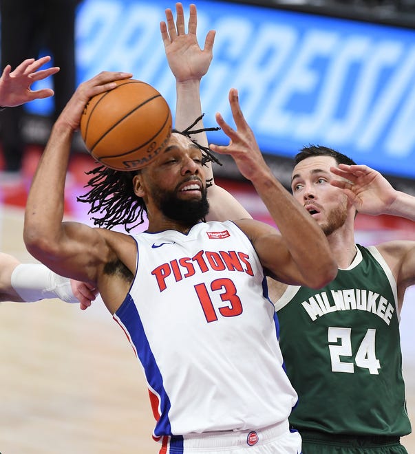 Pistons' Jahlil Okafor is fouled by Bucks' Pat Connaughton, (24), in the first quarter.