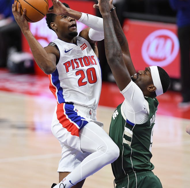 Pistons' Josh Jackson shoots over Bucks' Bobby Portis Jr. in the second quarter.