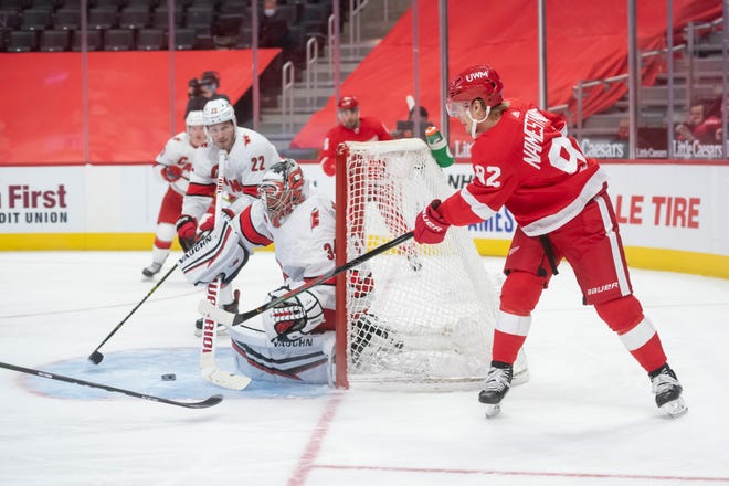 Detroit center Vladislav Namestnikov tries to slip the puck past Carolina goaltender Petr Mrazek in the third period during a game between the Detroit Red Wings and the Carolina Hurricanes, at Little Caesars Arena, in Detroit, January 14, 2021.