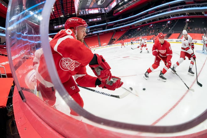 Detroit right wing Anthony Mantha passes the puck in the third period during a game between the Detroit Red Wings and the Carolina Hurricanes, at Little Caesars Arena, in Detroit, January 14, 2021.