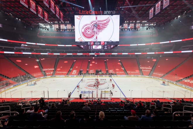 The two teams face off for the start of the home opener between the Detroit Red Wings and the Carolina Hurricanes, at Little Caesars Arena, in Detroit, January 14, 2021. Due to COVID-19 restrictions, a limited number of fans were allowed in for the game.