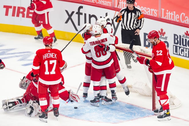 Carolina celebrates a goal by right wing Nino Niederreiter in the first period during a game between the Detroit Red Wings and the Carolina Hurricanes, at Little Caesars Arena, in Detroit, January 14, 2021.