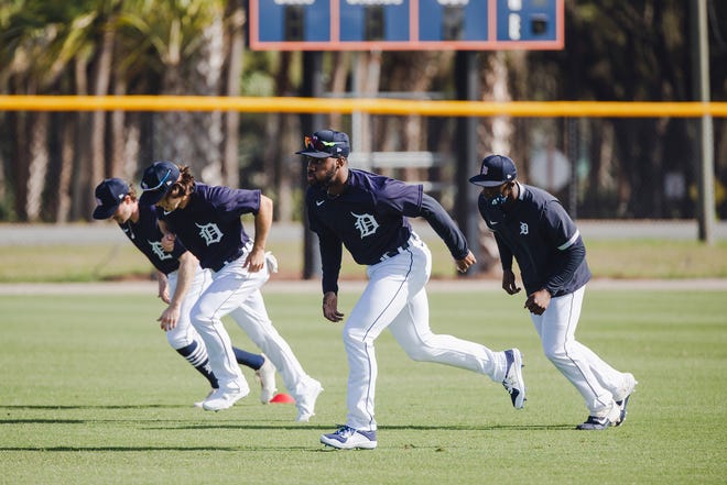 Tigers outfielders run in Lakeland, Florida on February 22, 2021.