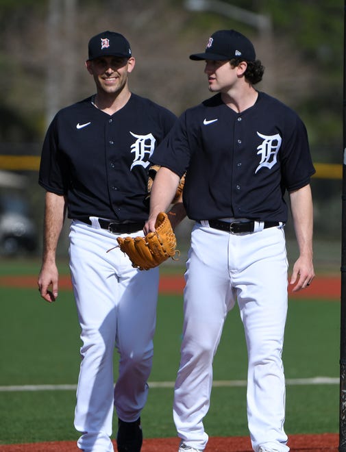From left, Tigers pitchers Matthew Boyd and Casey Mize walk toward the bullpen.