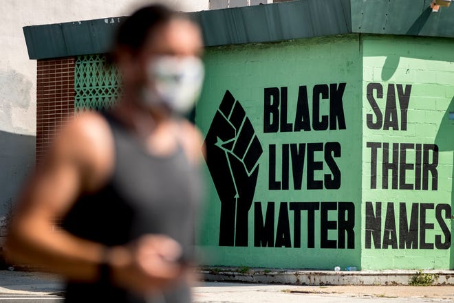FILE - In this July 13, 2020, file photo, a black lives matter mural is visible in the Shaw neighborhood in Washington.