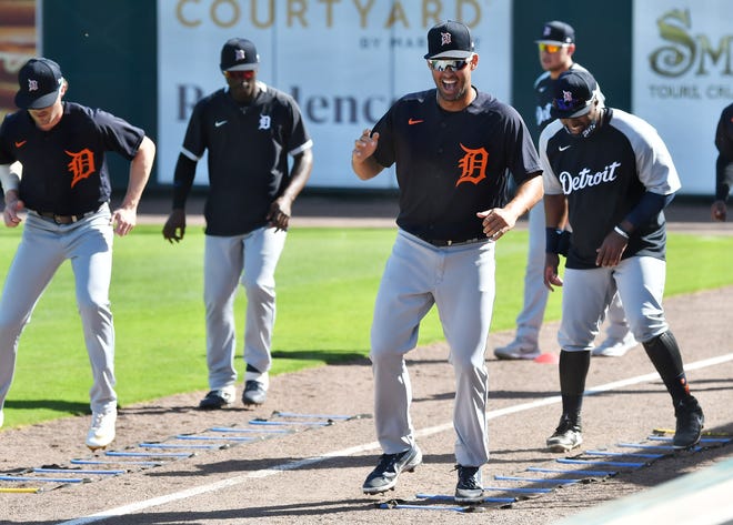 Tigers prospect Riley Greene, right front, smiles while doing footwork drills at the Detroit Tigers workout at Joker Marchant Stadium in Lakeland, Fla. on Feb. 27, 2021.