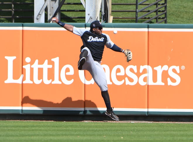 Tigers outfielder Christin Stewart cannot hold onto a catch at the Detroit Tigers workout at Joker Marchant Stadium in Lakeland, Fla. on Feb. 27, 2021.