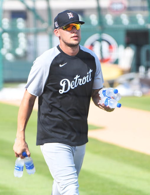 Tigers outfielder JaCoby Jones brings water out for his teammates at the Detroit Tigers workout at Joker Marchant Stadium in Lakeland, Fla. on Feb. 27, 2021.