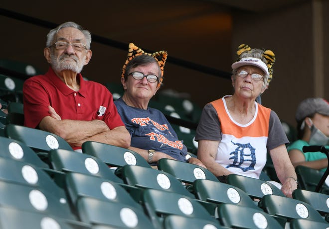 From left, Charles Currin, 81, Yvonne Trumbull, both of Brooklyn, Mich., and Georgia Scholl of Tipton watch the Tigers.