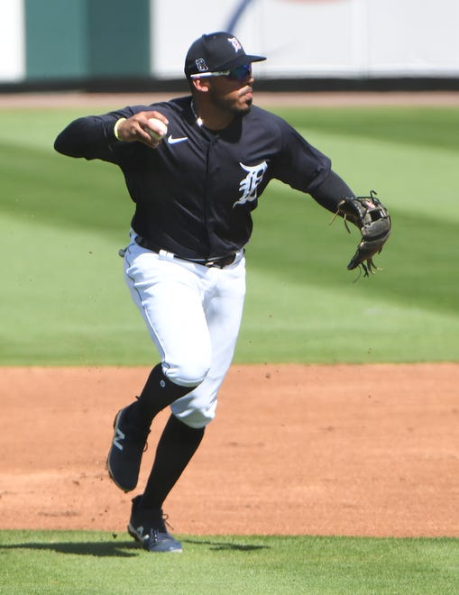 Tigers shortstop Harold Castro makes the throw to first in the first inning.
