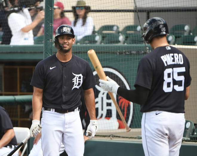 Tigers prospect Riley Greene talks with Daniel Pinero (85) on deck in the fifth inning.