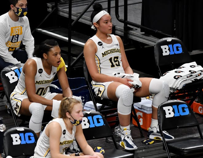 Michigan forward Naz Hillmon (00) and Michigan forward Hailey Brown (15) after exiting the game trailing late in the second half. Northwestern wins, 65-49.