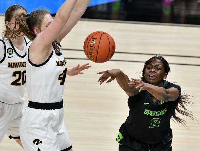 Michigan State forward Mardrekia Cook (2) passes the ball away from Iowa center Sharon Goodman (40) defending in the second half.
