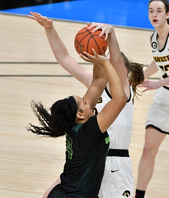 Michigan State forward Taiyier Parks (14) has her shot stopped and a jump ball called with Iowa center Sharon Goodman (40) defending in the second half.