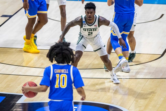Michigan State's Rocket Watts (2) sets up on defense as UCLA's Tyger Campbell (10) brings the ball up during the first half of a First Four game in the NCAA men's college basketball tournament Thursday, March 18, 2021, at Mackey Arena in West Lafayette, Ind.