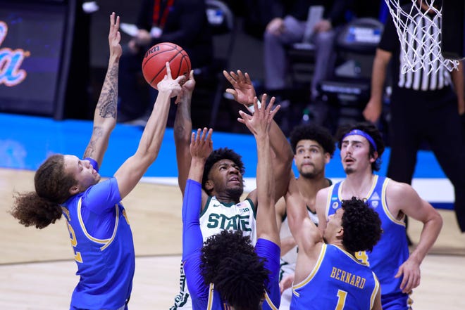 Aaron Henry (0) of the Michigan State Spartans shoots against the UCLA Bruins during the first half.