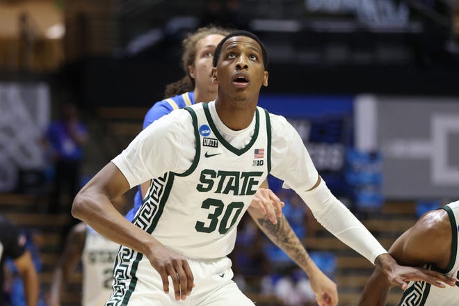 Marcus Bingham Jr. (30) of the Michigan State Spartans looks for the rebound against the UCLA Bruins during the first half.