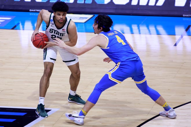 Malik Hall (25) of the Michigan State Spartans is guarded by Jaime Jaquez Jr. (4) of the UCLA Bruins during the first half.