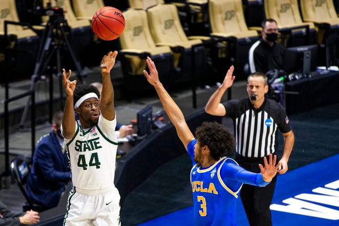 Michigan State's Gabe Brown (44) shoots a 3-pointer over UCLA's Johnny Juzang (3) during the first half.