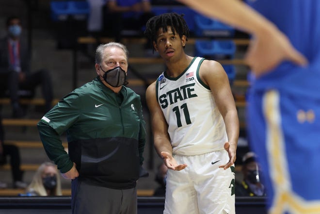 Head coach Tom Izzo of the Michigan State Spartans talks with A.J. Hoggard (11) against the UCLA Bruins during the second half.
