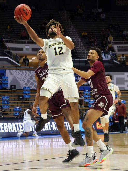 Mike Smith (12) of the Michigan Wolverines shoots against the Texas Southern Tigers during the second half.