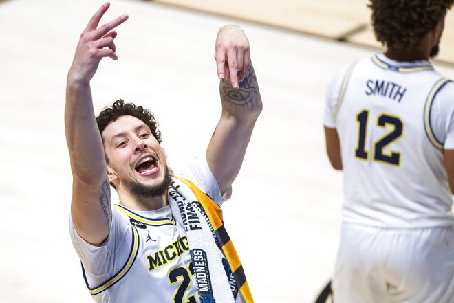 Michigan's Brandon Johns Jr. celebrates as he exits the court following Michigan's win over Texas Southern in a first-round game in the NCAA men's college basketball tournament, Saturday, March 20, 2021, at Mackey Arena in West Lafayette, Ind.