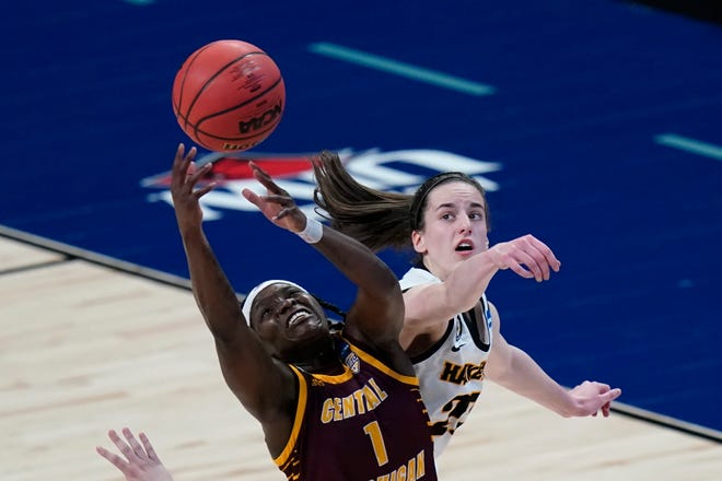 Central Michigan guard Micaela Kelly (1) fights for a rebound with Iowa guard Caitlin Clark, right, during the second half of of an NCAA Tournament game Sunday, March 21, 2021, at the Alamodome in San Antonio. Iowa won, 87-72.