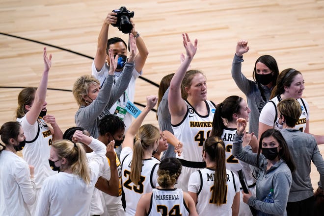 Iowa players and coaches celebrate after their win over Central Michigan on Sunday.