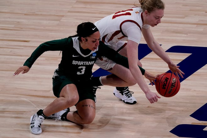 Iowa State guard Emily Ryan (11) battles Michigan State guard Alyza Winston (3) for a loose ball during the first half.