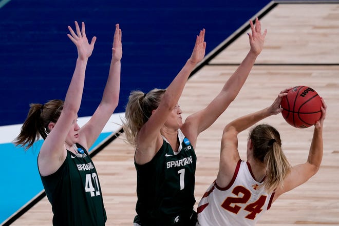 Iowa State guard Ashley Joens (24) is pressured by Michigan State guards Julia Ayrault (40) and Tory Ozment (1) during the first half.
