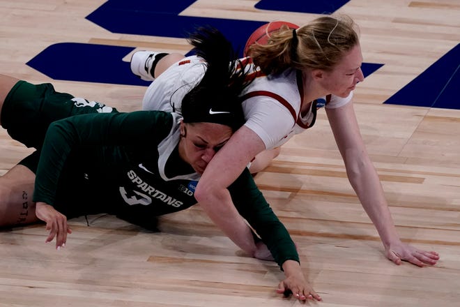 Iowa State guard Emily Ryan (11) battles Michigan State guard Alyza Winston (3) for a loose ball during the first half.