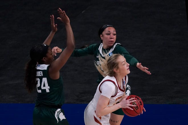 Iowa State guard Kylie Feuerbach, front right, looks to pass under pressure from Michigan State guards Nia Clouden (24) and Alyza Winston (3) during the first half.