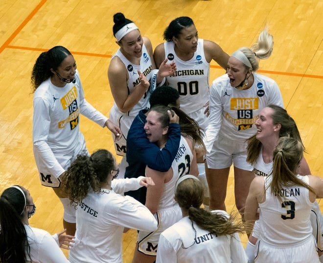 Michigan celebrates its win over Florida Gulf Coast in the first round of the women's NCAA tournament at the University of Texas San Antonio Convocation Center in San Antonio, Texas, Sunday March 21, 2021. Michigan won 87-66.