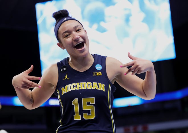 Michigan's Hailey Brown (15) celebrates after her team's win.