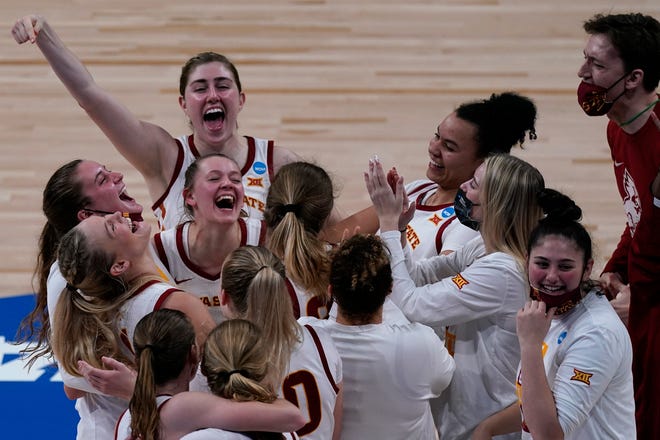 Iowa State players celebrate after their 79-75 win  against Michigan State in the first round of the women's NCAA Tournament on Monday, March 22, 2021, in San Antonio.