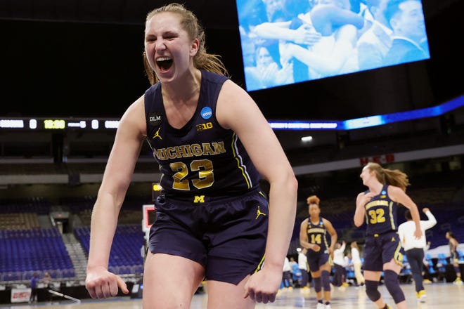 Michigan's Danielle Rauch (23) celebrates after the win.