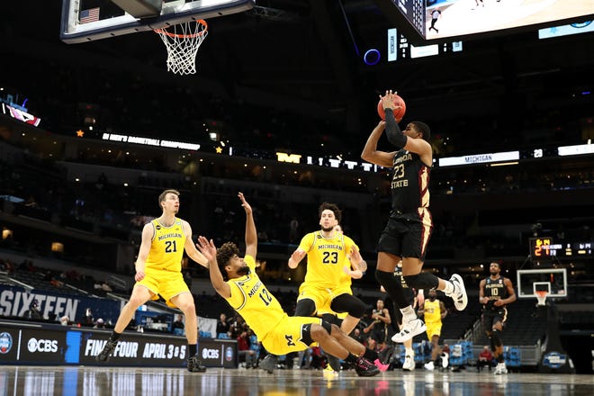 Florida State's M.J. Walker goes up for a shot against the Michigan Wolverines in the first half.