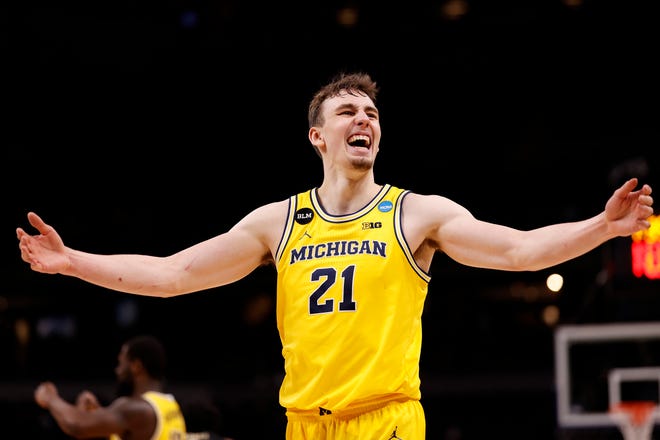 Michigan's Franz Wagner celebrates in the final moments of the Wolverines' 76-58 victory over Florida State Seminoles in the 2021 NCAA Men's Basketball Tournament at Bankers Life Fieldhouse on March 28, 2021 in Indianapolis, Indiana. Michigan now advances to the Elite Eight.