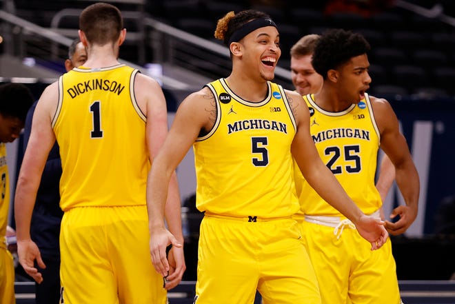 Michigan's Terrance Williams II (5) and the Wolverines celebrate in the final moments of their Sweet Sixteen round win over the Florida State Seminoles.