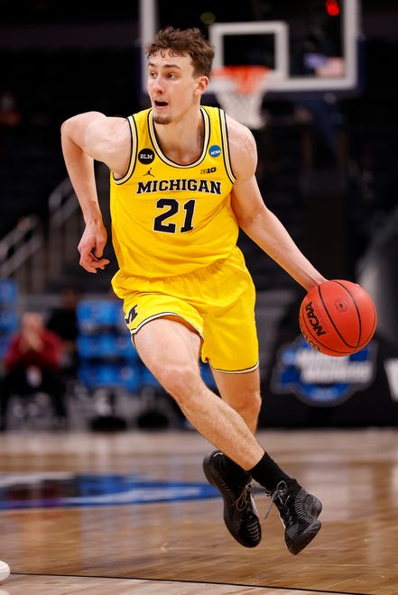Michigan's Franz Wagner brings the ball up the court.