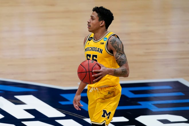 Michigan guard Eli Brooks drives up court during the second half of an Elite 8 game against UCLA in the NCAA men's college basketball tournament at Lucas Oil Stadium, Tuesday, March 30, 2021, in Indianapolis.