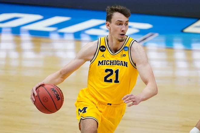 Michigan guard Franz Wagner drives up court during the first half.