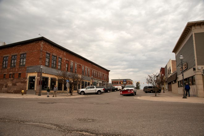 A view of downtown Munising at the corner of Elm Avenue and Superior Street on Tuesday, March 30, 2021.