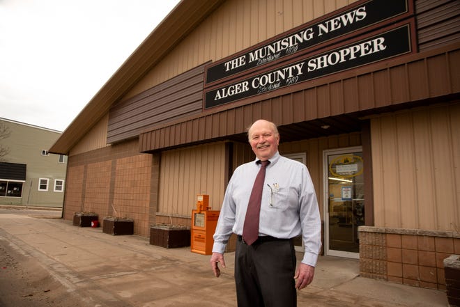Willie Peterson, co-owner and publisher of The Munising News, stands in front of the newspaper's office in Munising on Tuesday, March 30, 2021.