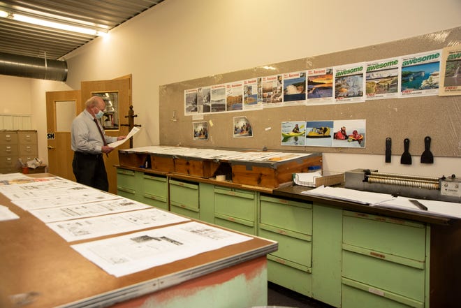 Willie Peterson, co-owner and publisher of The Munising News, proofs the pages of the final edition of the newspaper on Tuesday, March 30, 2021. The paper has served Munising in Michigan's Upper Peninsula for the past 125 years. The final edition published on March 31, 2021.