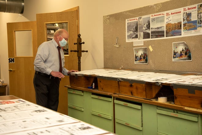 Willie Peterson, co-owner and publisher of The Munising News proofs the pages of the final edition of the newspaper on Tuesday, March 30, 2021. The paper has served Munising in Michigan's Upper Peninsula for the past 125 years. The final edition published on March 31, 2021.