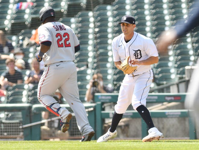 Tigers pitcher Matthew Boyd looks back to check the runner at third base after tagging Twins' Miguel Sano in the fifth inning.