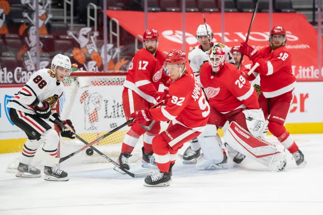 Detroit center Vladislav Namestnikov pounces on a loose puck in the second period during a game between the Detroit Red Wings and the Chicago Blackhawks, at Little Caesars Arena, in Detroit, April 15, 2021.