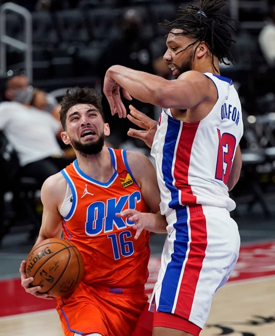 Oklahoma City Thunder guard Ty Jerome (16) runs into the defense of Detroit Pistons center Jahlil Okafor (13) during the first half.
