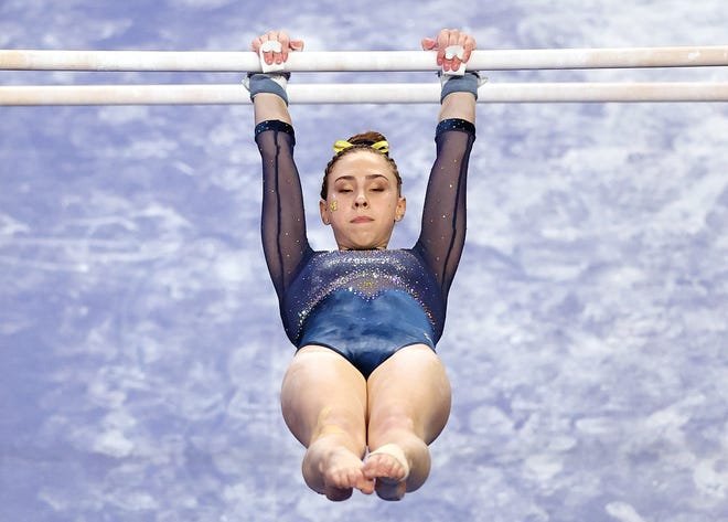 FORT WORTH, TEXAS - APRIL 17:  Natalie Wojcik of the Michigan Wolverines competes on the uneven parallel bars during the 2021 NCAA Division I Women's Gymnastics Championship.